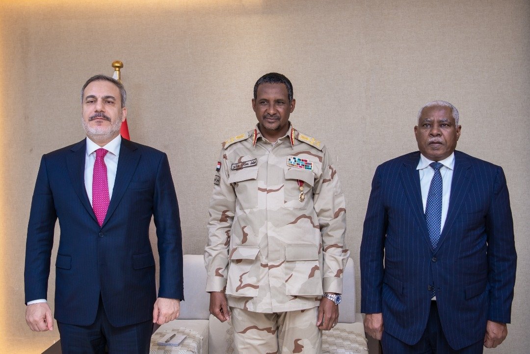 Türkiye’s National Intelligence Organization (MIT) chief Hakan Fidan (L) poses with the co-chair of Sudan&#039;s Sovereignty Council, Gen. Mohamed Hamdan Dagalo (C), following talks in the capital Khartoum, Sudan, Jan. 16, 2023. (AA Photo)