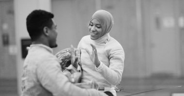 American Olympic fencer Ibtihaj Muhammad (right) shakes hands with Zaheer Booth after a training session at the Fencers Club, New York City, US,  July 7, 2016. (Getty Images Photo)