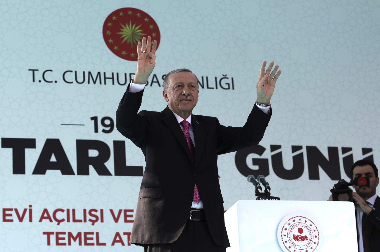 President Recep Tayyip Erdoğan salutes supporters at an inauguration ceremony of new government buildings in Ankara, Türkiye, Oct. 19, 2022. (AP Photo)