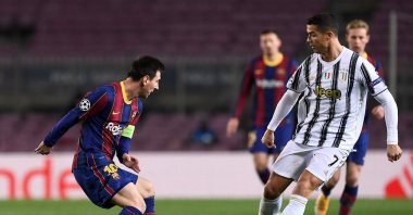 Former Barcelona's forward Lionel Messi (L) challenges former Juventus' forward Cristiano Ronaldo during the UEFA Champions League group G football match between Barcelona and Juventus at the Camp Nou stadium, Barcelona, Spain, Dec. 08, 2020. (AFP Photo)