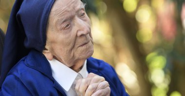 Sister Andre, Lucile Randon, prays in a wheelchair, on the eve of her 117th birthday, in Toulon, southern France, Feb. 10, 2021. (AFP Photo)