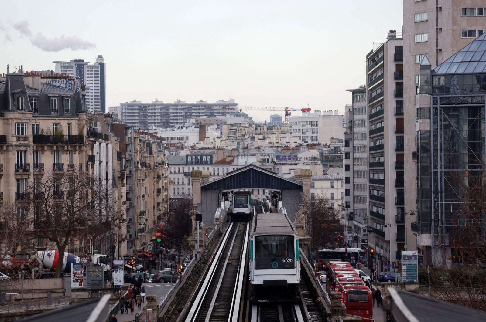 A subway operated by the Paris transport network RATP makes its way on an elevated metro line in Paris on the eve of a nationwide day of strike and protests in key sectors like energy, public transport, air travel and schools against the pension reform in France, Jan. 18, 2023.  (Reuters Photo)