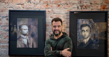 Andreas Georgiadis poses with his artworks, Istanbul, Türkiye, Jan. 17, 2023. (Photo courtesy of Andreas Georgiadis)