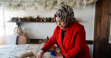 Kastamonu Art Women's Cooperative President Serpil Durgut presents the region's traditional handicrafts, Kastamonu, Türkiye, Jan. 19, 2023. (IHA Photo)