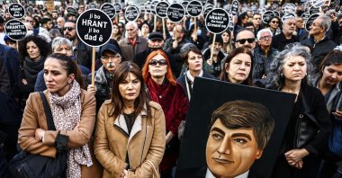 People attend a rally to mark the 16th anniversary of Turkish-Armenian journalist Hrant Dink&#039;s death, in front of the Agos newspaper office in Istanbul, Jan. 19, 2023. (EPA Photo)