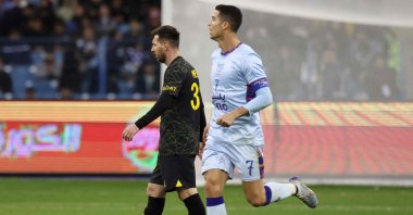 Paris Saint-Germain's Argentine forward Lionel Messi (L) and Riyadh All-Star's Portuguese forward Cristiano Ronaldo (R) on the pitch during the Riyadh Season Cup football match at the King Fahd Stadium in Riyadh, Saudi Arabia, Jan. 19, 2023. (AFP Photo)