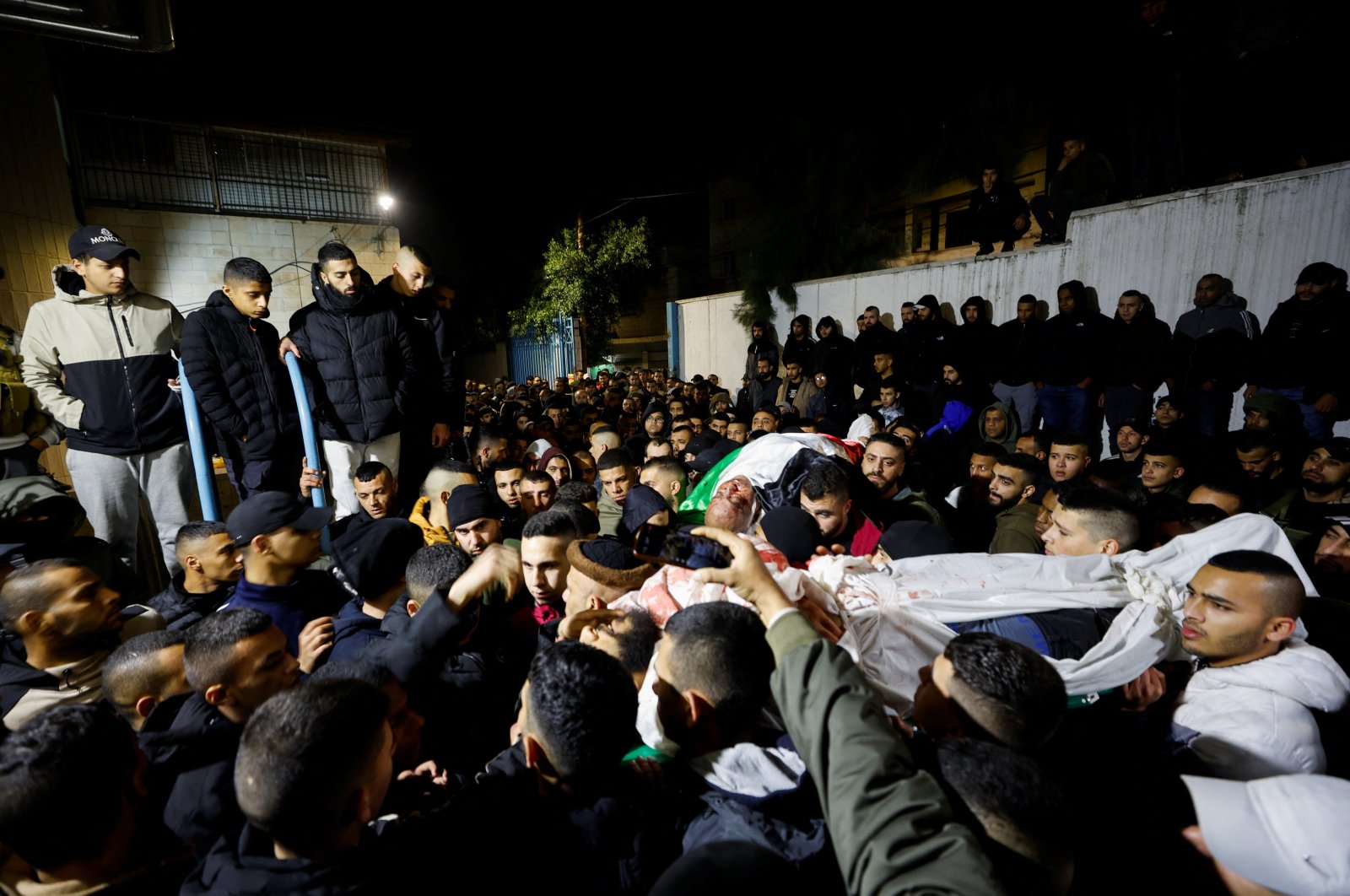 Mourners carry the body of two Palestinians killed in an Israeli army raid, Jenin, occupied West Bank, Palestine, Jan. 19, 2023. (Reuters Photo)