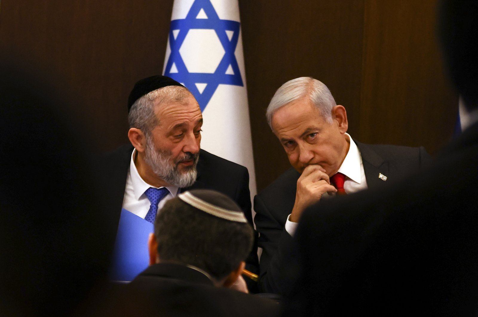 Israeli Prime Minister Benjamin Netanyahu (R) speaks with Interior and Health Minister Aryeh Deri at a weekly cabinet meeting in Jerusalem, Jan. 8, 2023. (EPA Photo)
