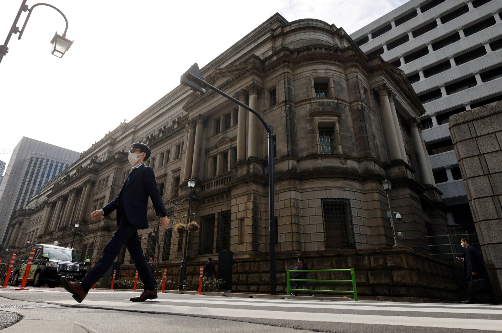 A man walks in front of the headquarters of the Bank of Japan in Tokyo, Japan, Jan. 18, 2023. (Reuters Photo)
