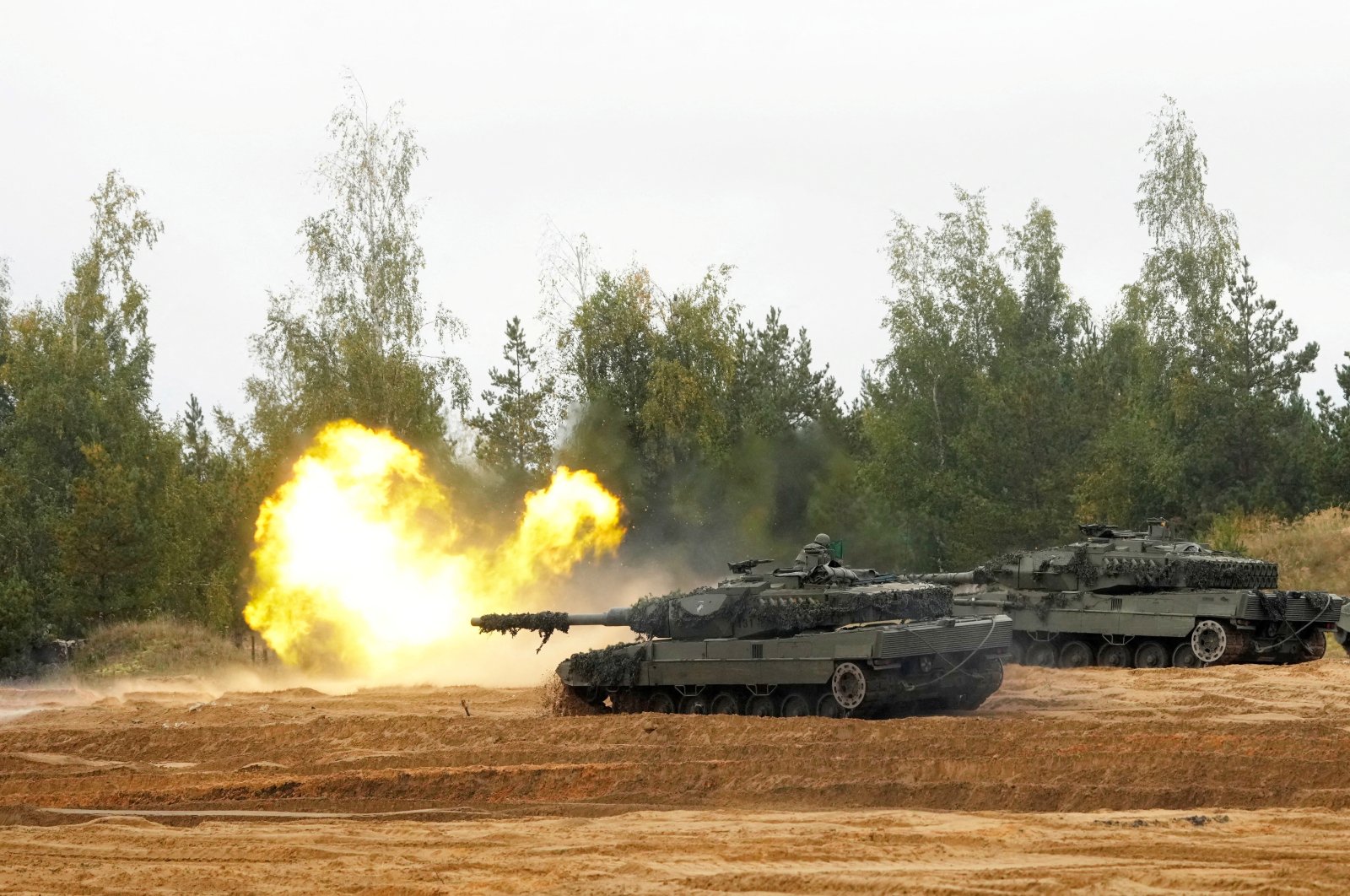 NATO enhanced Forward Presence battle group Spanish army tank Leopard 2 fires during the final phase of the Silver Arrow 2022 military drill on Adazi military training grounds, Latvia, Sept. 29, 2022. (Reuters Photo)