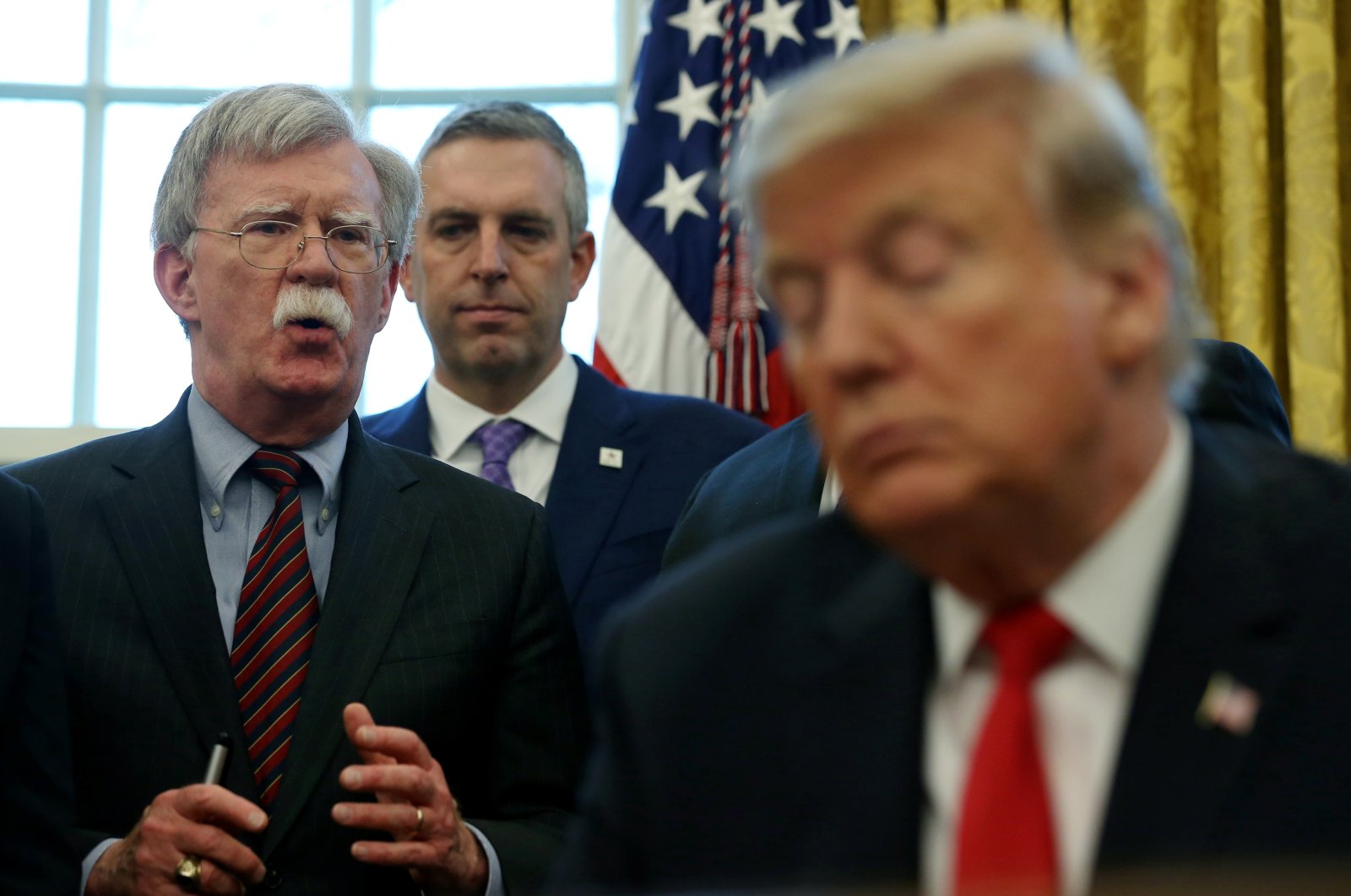 U.S. President Donald Trump listens as his national security adviser John Bolton speaks during a presidential memorandum signing for the &quot;Women&#039;s Global Development and Prosperity&quot; initiative in the Oval Office at the White House in Washington, U.S., Feb. 7, 2019. (Reuters Photo)