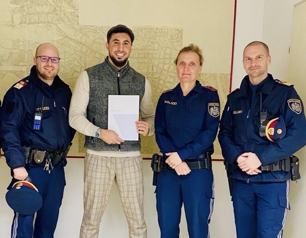 Güven Dağ (2nd L) is presented with a certificate of appreciation by the Vienna Police Department, Vienna, Austria, Jan. 20, 2023. (AA Photo)