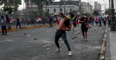 People throw stones at the Peruvian police during demonstrations, Lima, Peru, Jan. 19, 2023. (AA Photo)