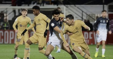 Ceuta's Juan Gutierrez in action with FC Barcelona's Robert Lewandowski and Ansu Fati during Copa del Rey round of 16 match at the Alfonso Murube Stadium, Ceuta, Spain, Jan. 19, 2023. (Reuters Photo)