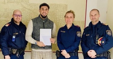 Güven Dağ (2nd L) is presented with a certificate of appreciation by the Vienna Police Department, Vienna, Austria, Jan. 20, 2023. (AA Photo)