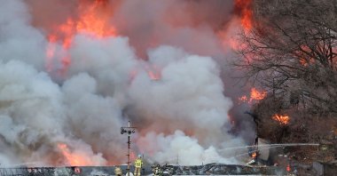 Firefighters try to extinguish a fire at the Guryong village, one of South Korea&#039;s last remaining slums, in southern Seoul, South Korea, Jan. 20, 2023. (AFP Photo)