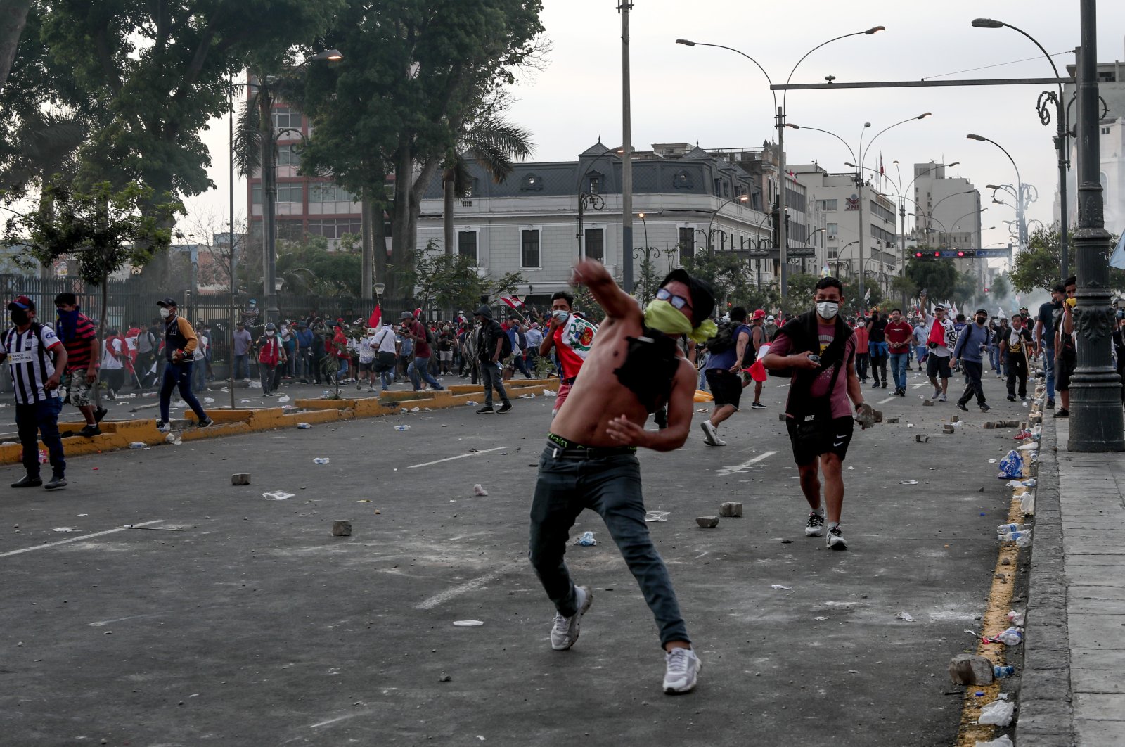 People throw stones at the Peruvian police during demonstrations, Lima, Peru, Jan. 19, 2023. (AA Photo)