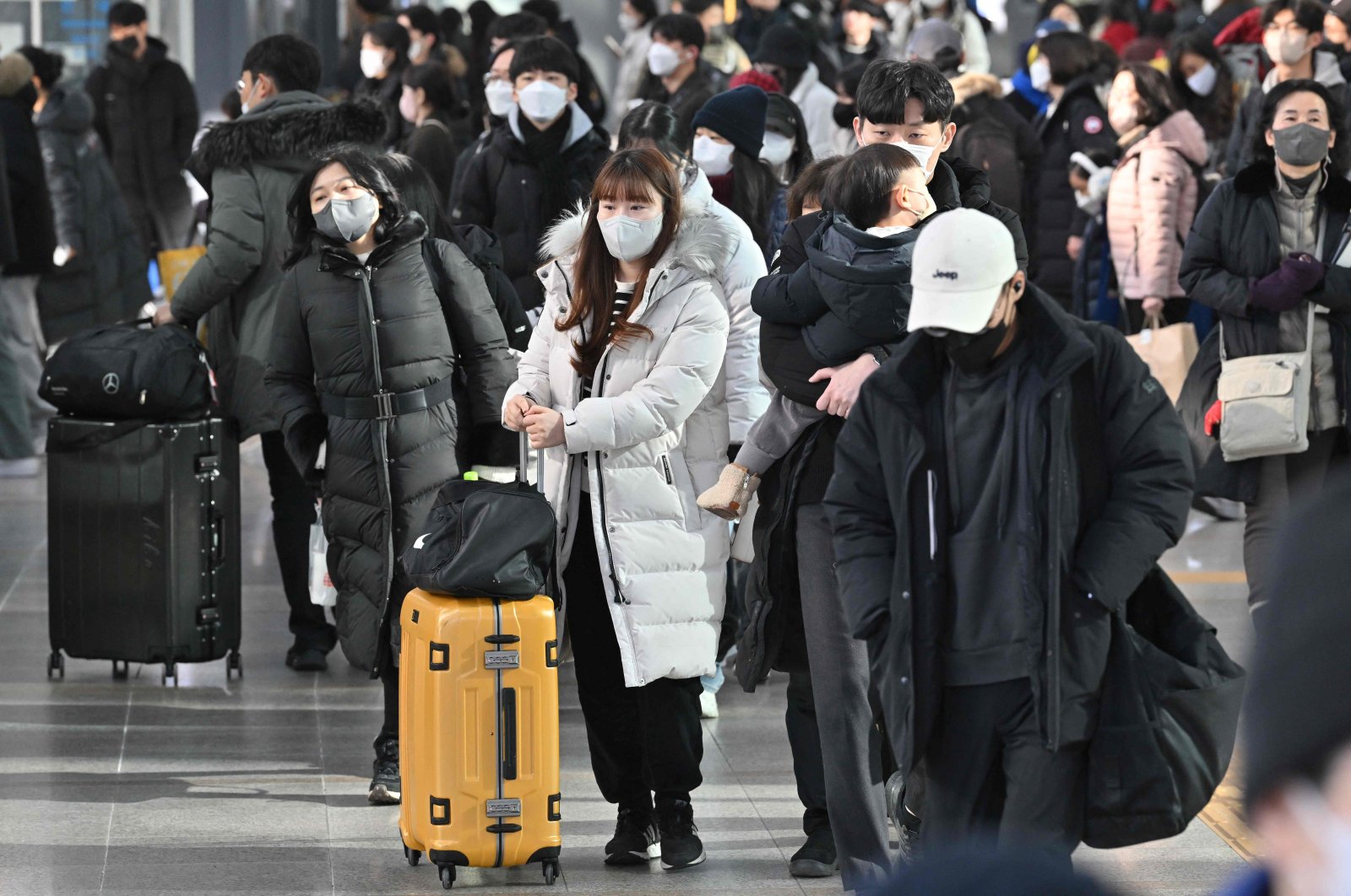 Passengers walk through a Seoul railway station ahead of the Lunar New Year holidays, Seoul, South Korea, Jan. 20, 2023. (AFP Photo)