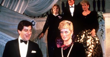 Diana, Princess of Wales, wearing a long purple Catherine Walker evening gown, attends a charity evening on behalf of Birthright at Garrard the Jewellers, London, U.K., Oct. 27, 1987. (Getty Images Photo)