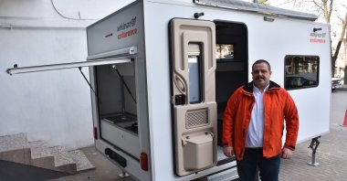 Mukadder Rodoplu is seen outside his manufactured caravan in Bursa, Jan. 22, 2023. (AA Photo)