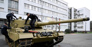 Members of the military walk on a tank, as Germany delivers its first Leopard tanks to Slovakia as part of a deal after Slovakia donated fighting vehicles to Ukraine, in Bratislava, Slovakia, Dec. 19, 2022. (Reuters Photo)