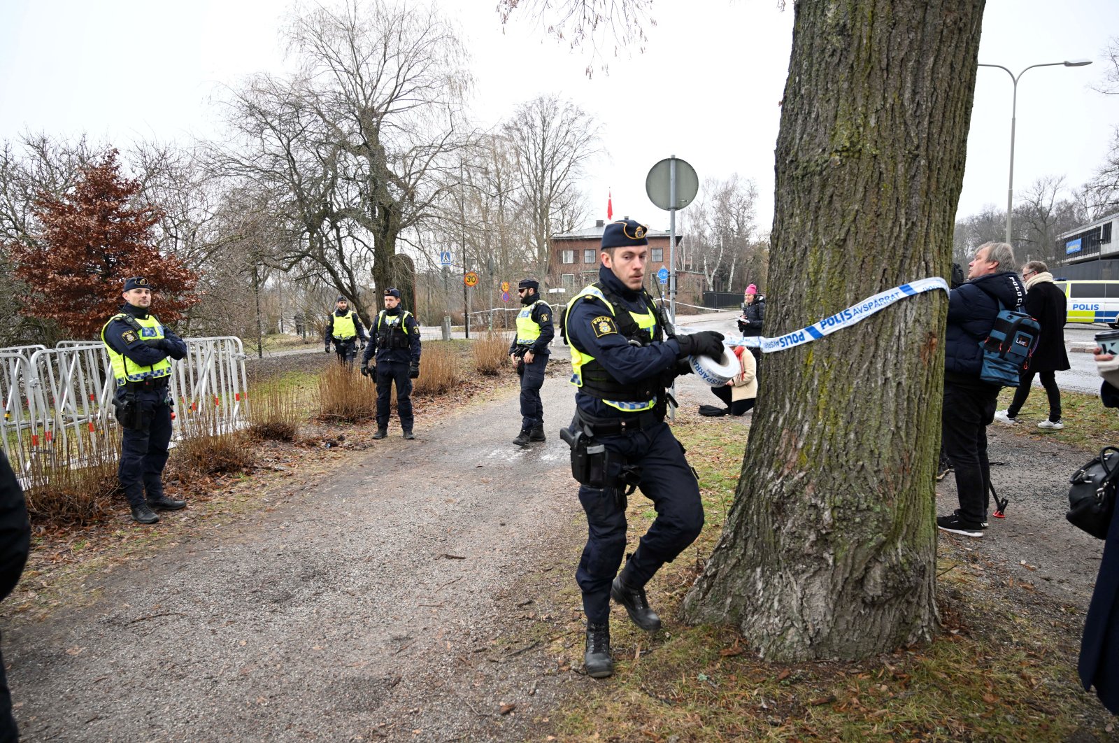 Police cordon off the area where leader of the far-right Danish political party Stram Kurs Rasmus Paludan has planned to burn the Quran outside the Turkish Embassy in Stockholm, Sweden, Jan. 21, 2023. (Reuters Photo)