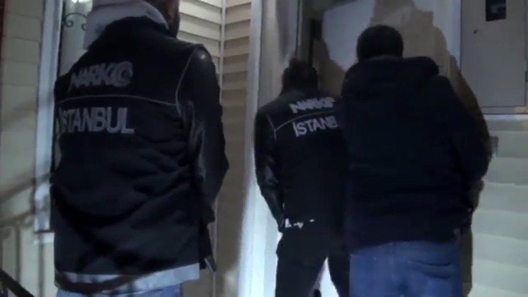 In this undated photo, police escort one of the 3,916 suspects detained in operations carried out by Istanbul Police Department Anti-Narcotic Crimes Branch teams in the first three weeks of January, Istanbul, Türkiye. (IHA Photo)