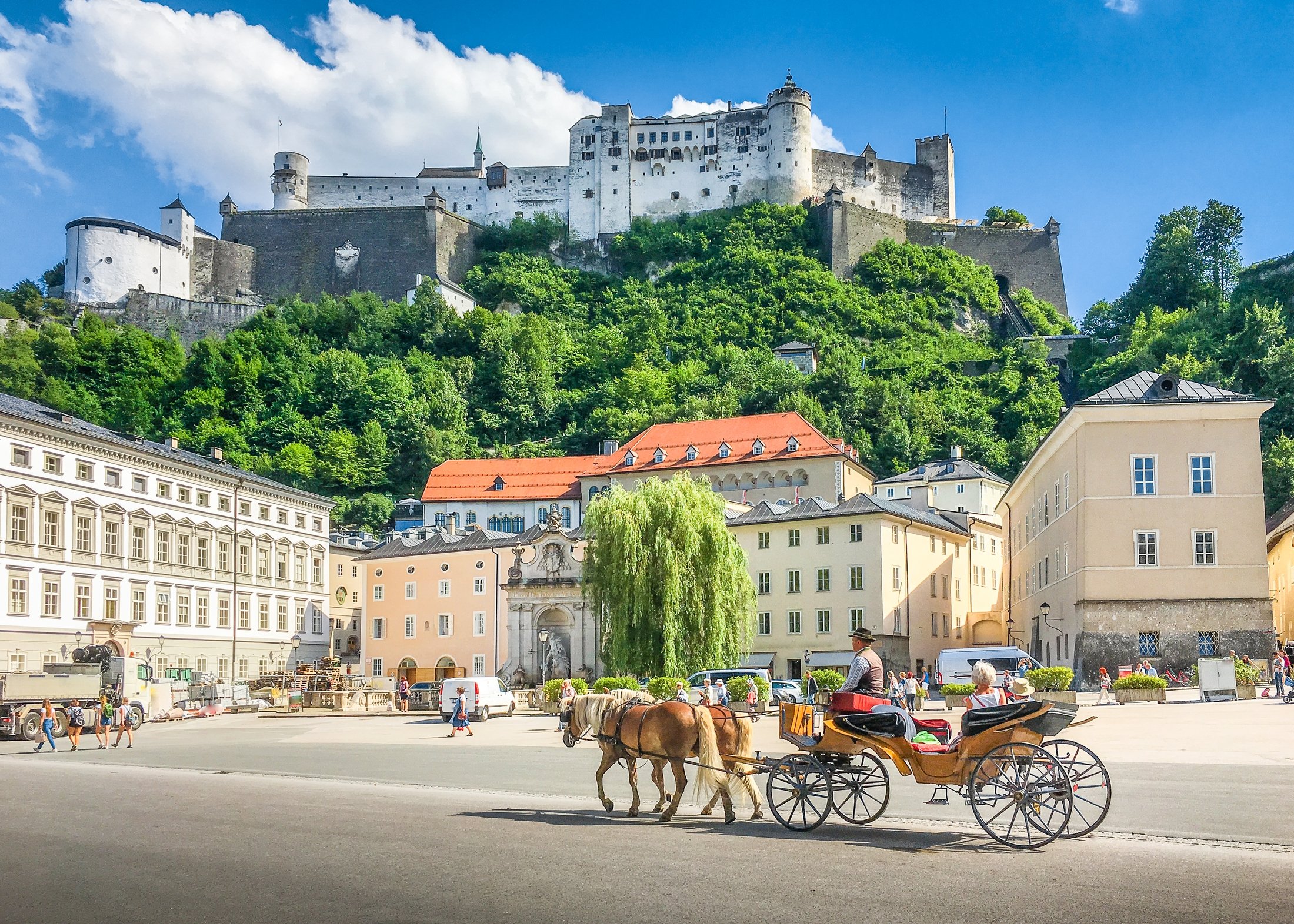 The Hohensalzburg Fortress as seen from a city street, in Salzburg, Austria. (Shutterstock Photo)