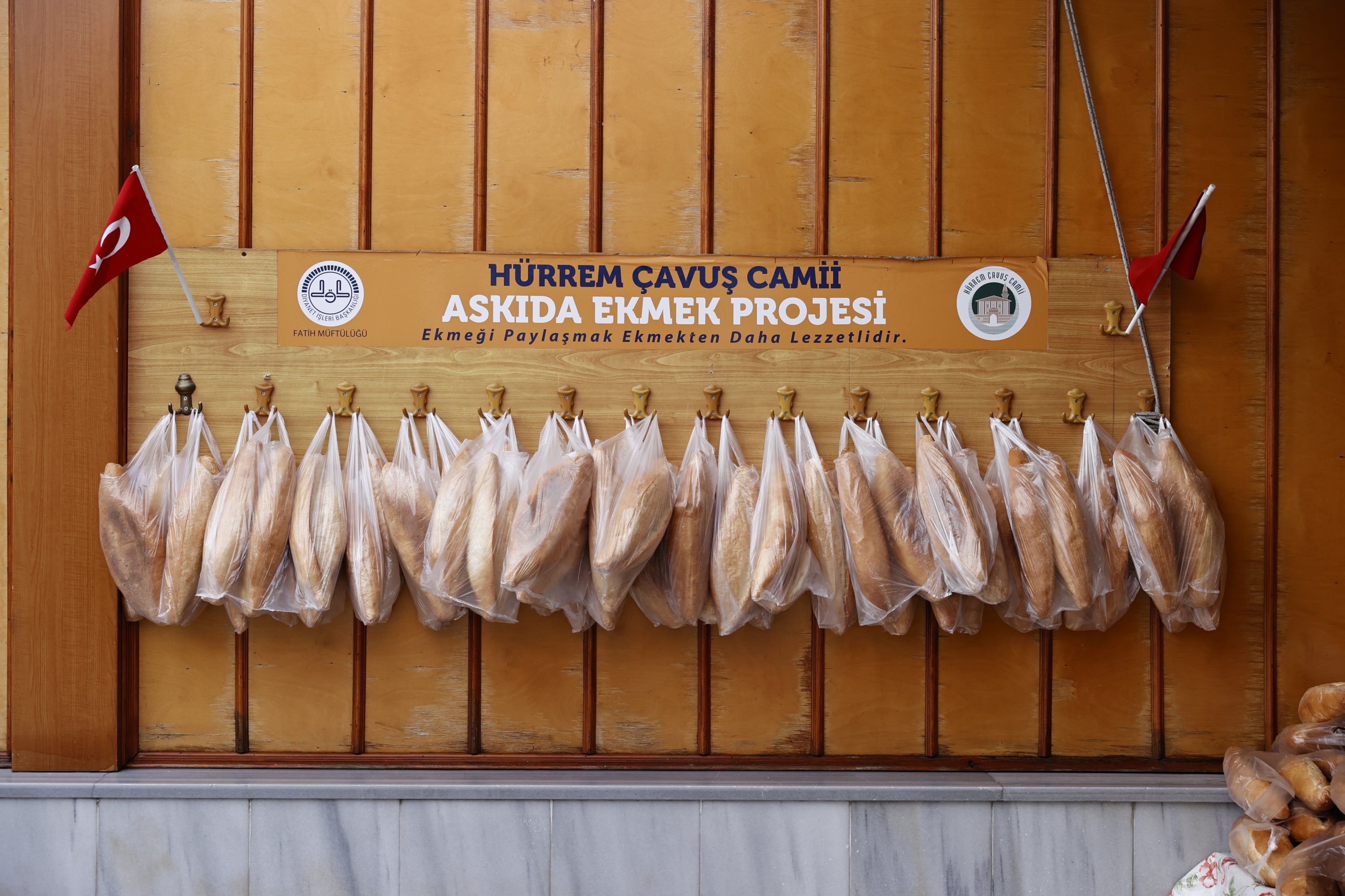 Free bread for the neighborhood's most destitute families are seen hanging on the wall in the Hürrem Çavuş Mosque in Istanbul. (AA Photo)