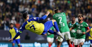 Al Nassr's Cristiano Ronaldo in action with Al Ettifaq's Saeed al-Mowalad during the Saudi Pro League match at the Mrsool Park, Riyadh, Saudi Arabia, Jan. 22, 2023. (Reuters Photo)
