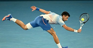 Serbia's Novak Djokovic hits a return against Australia's Alex De Minaur during their men's singles match on Day Eight of the Australian Open tennis tournament, Melbourne, Australia, Jan. 23, 2023. (AFP Photo)