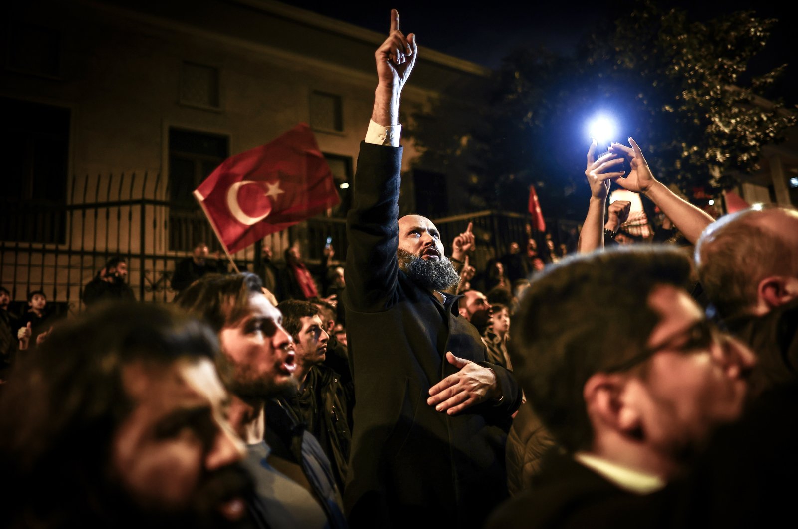 Demonstrators denounce far-right politician Rasmus Paludan after he burned a copy of the Holy Quran in front of the Turkish Embassy in Stockholm during a protest outside the Swedish Consulate-General, Istanbul, Türkiye, Jan. 22, 2023. (EPA Photo) 
