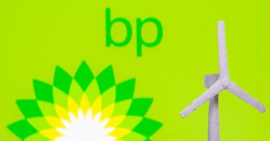 A windmill is seen in front of the BP logo in this illustration picture, Aug. 11, 2021. (Reuters File Photo)