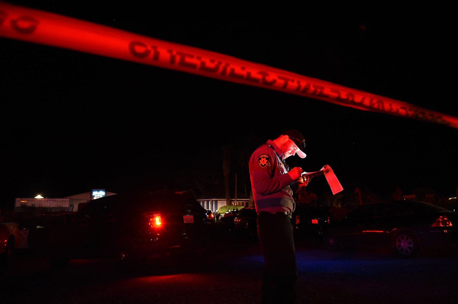 A San Mateo County sheriff deputy stands at the scene of a shooting on Highway 92 in Half Moon Bay, California, U.S., Jan. 23, 2023. (AFP Photo)