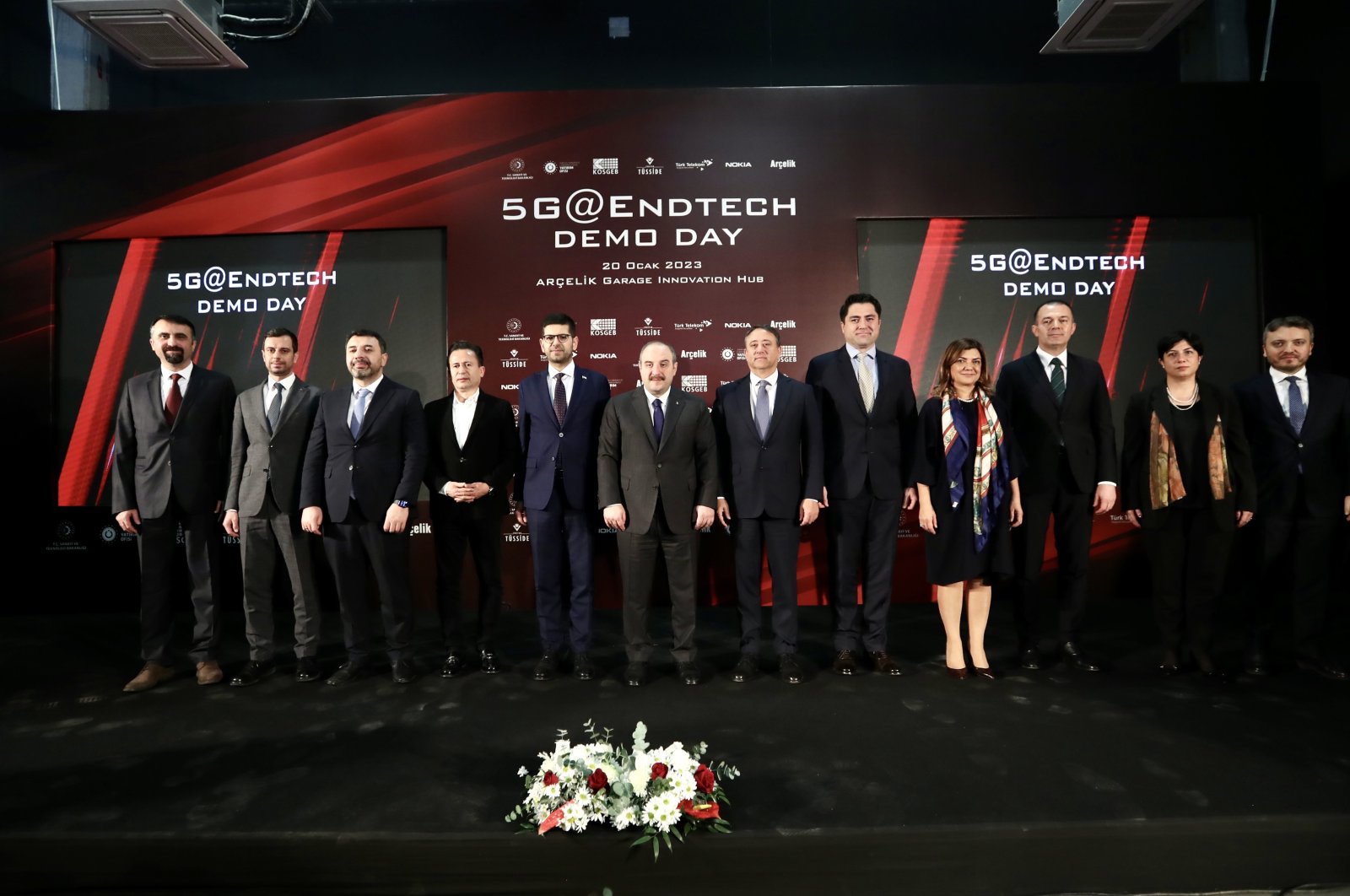 Industry and Technology Minister Mustafa Varank (C) and other officials and executives pose for a photo during the 5G@EndTech Demo Day in Istanbul, Türkiye, Jan. 20, 2023. (AA Photo)