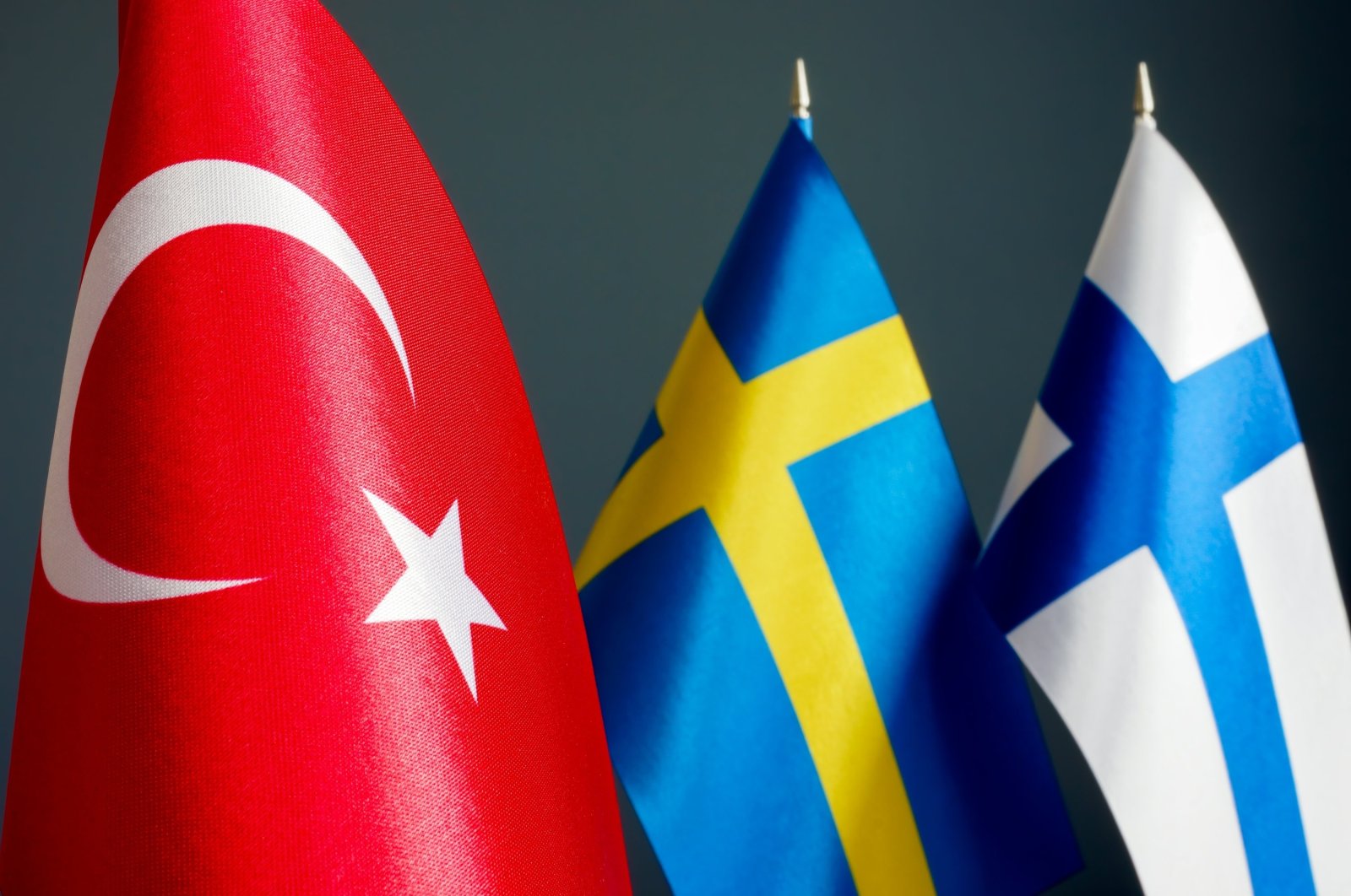 From left to right, the flags of Türkiye, Sweden and Finland are seen. (Shutterstock File Photo)