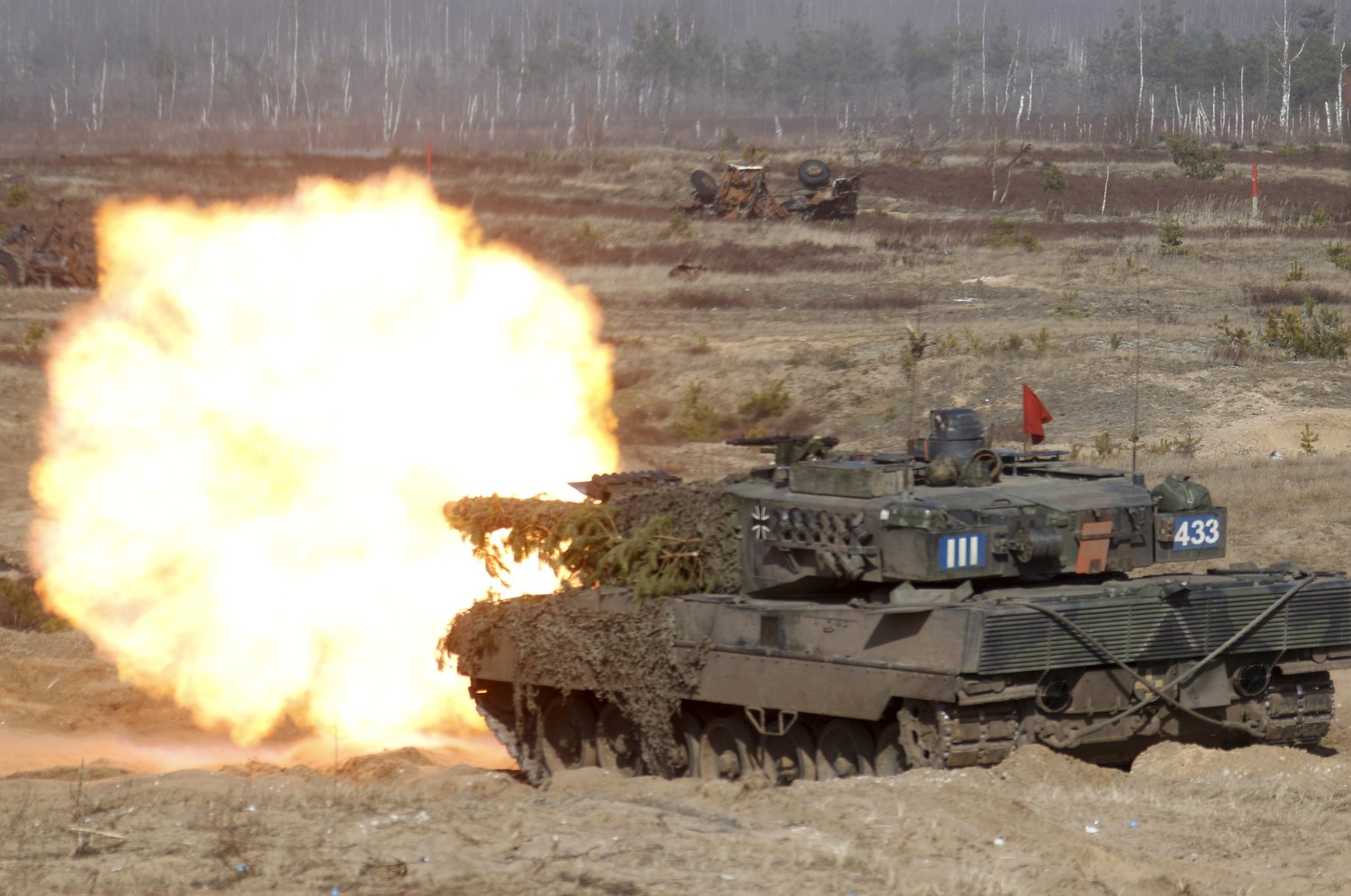 German soldiers of the NATO Extended Presence Battlegroup with their &#039;Leopard 2&#039; battle tank participate in the military exercise Crystal Arrow 2021 in Adazi Military base, Latvia, March 26, 2021 (reissued 24 Jan. 2023). (EPA Photo)