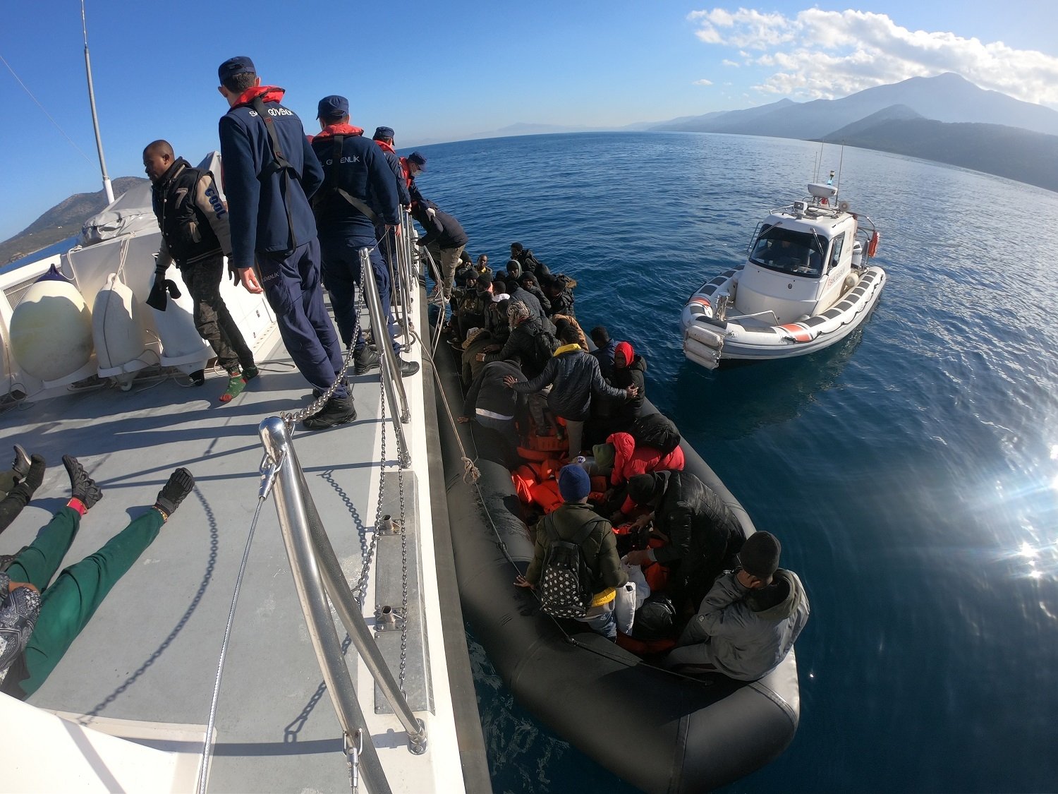 Turkish coast guard pulls out of the sea some 59 irregular migrants pushed back into Türkiye&#039;s territorial waters off the coast of its western province Aydın, Jan. 24, 2023. (AA Photo)