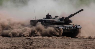 Soldiers on a Polish Leopard tank as troops from Poland, U.S., France and Sweden take part in the DEFENDER-Europe 22 military exercise, in Nowogard, Poland, May 19, 2022. (AFP Photo)