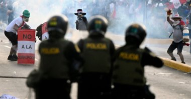 Riot policemen clash with demonstrators during a protest against the government of Dina Boluarte asking for her resignation and the closure of Congress, Lima, Peru, Jan. 24, 2023. (AFP Photo)