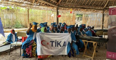 Tanzanian women hold the TIKA flag to pay a vote of thanks to Türkiye, Jan. 25, 2023. (Courtesy of TIKA)