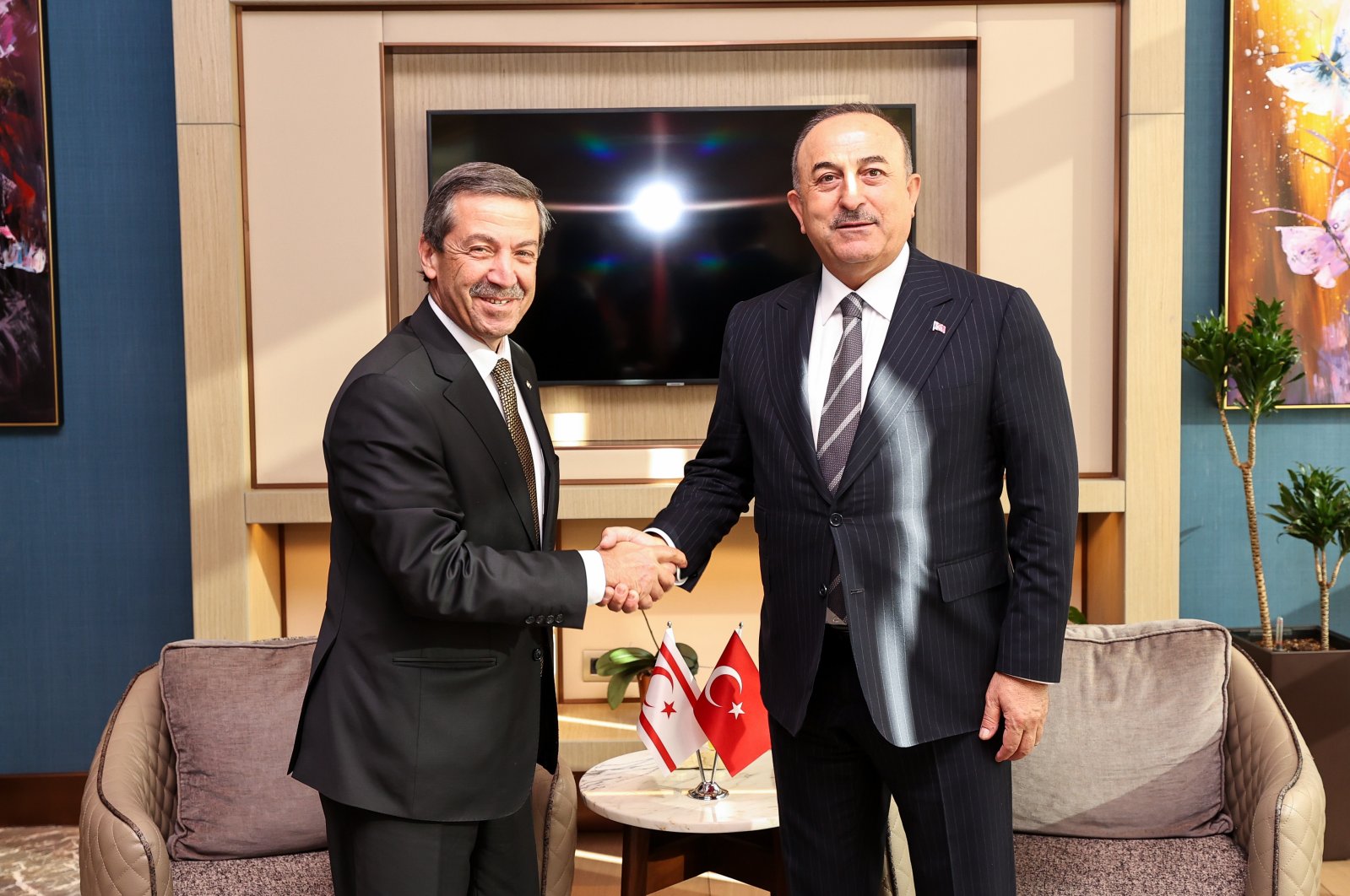 Foreign Minister Mevlüt Çavuşoğlu (R) is seen with Foreign Minister Tahsin Ertuğruloğlu of the Turkish Republic of Northern Cyprus (TRNC) in the Uzbek capital Tashkent, Jan. 24, 2023. (AA Photo)