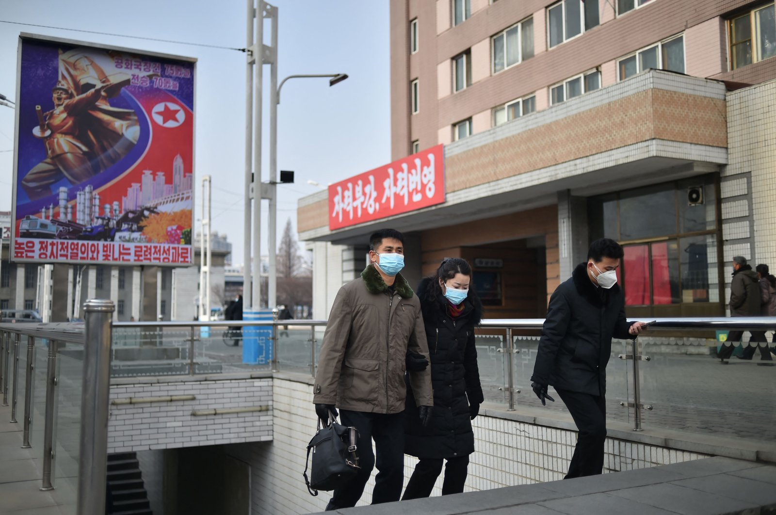 People walk on a street in Pyongyang, North Korea, Jan. 22, 2023. (AFP Photo)