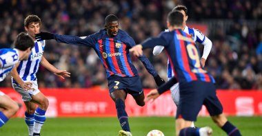 Barcelona's French forward Ousmane Dembele (C) kicks the ball during the Copa del Rey quarter final football match against Real Sociedad, at the Camp Nou stadium, Barcelona, Spain, Jan. 25, 2023. (AFP Photo)