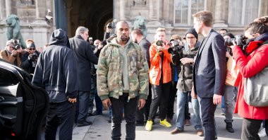 Kanye West posing for photographers in front of the Dries van noten fashion show, Paris, France, March 4, 2015. (Shutterstock Photo)