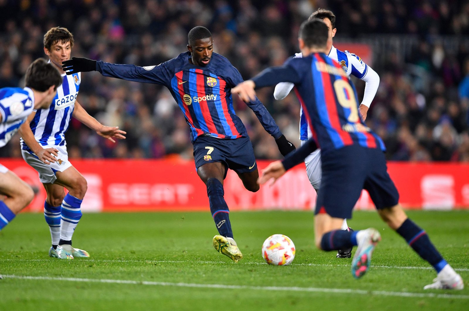 Barcelona&#039;s French forward Ousmane Dembele (C) kicks the ball during the Copa del Rey quarter final football match against Real Sociedad, at the Camp Nou stadium, Barcelona, Spain, Jan. 25, 2023. (AFP Photo)