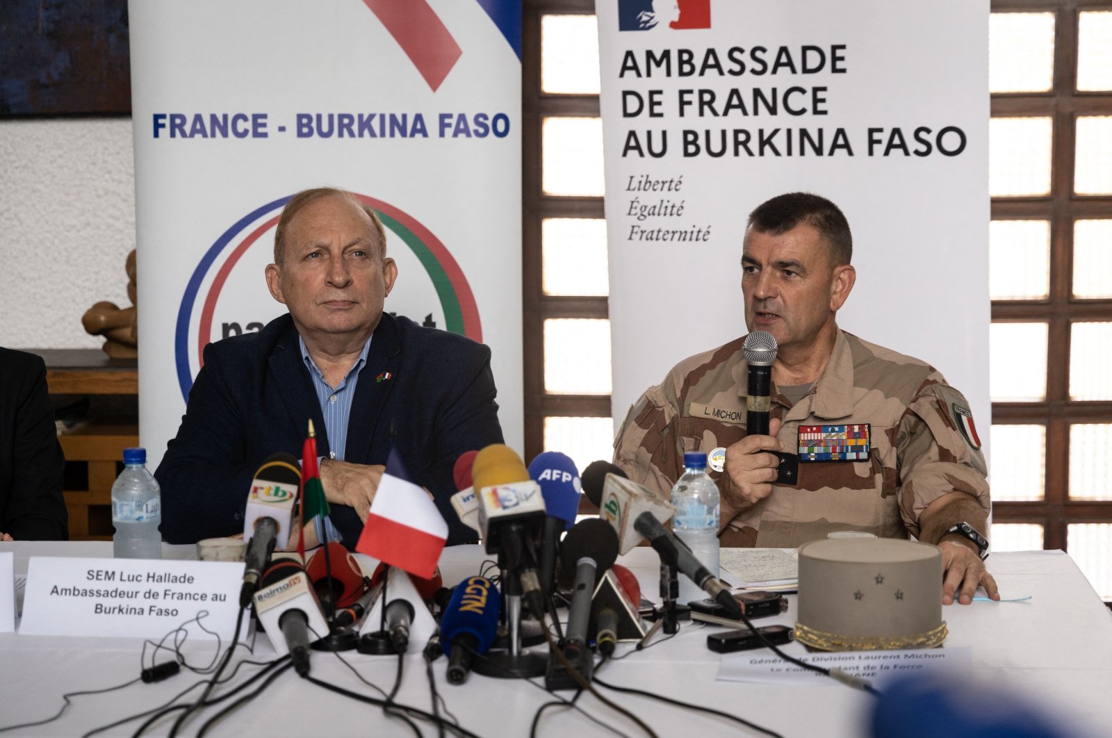 French ambassador to Burkina Faso Luc Hallade (L) and Gen. Laurent Michon (R), Commander of Barkhane Force, speak at a press conference, Ouagadougou, Burkina Faso, July 21, 2022. (AFP Photo)