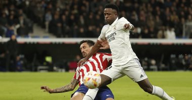 Real Madrid's Vinicius Junior (R) in action against Atletico Madrid's Stefan Savic (L) at the Santiago Bernabeu Stadium, Madrid, Spain, Jan. 26, 2023. (AA Photo)