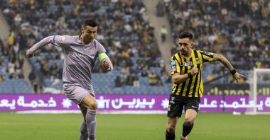 Al-Nassr' Cristiano Ronaldo (L) in action against Al-Ittihad's Igor Coronado (R) during Saudi Super Cup semifinal match at the King Fahd International Stadium, Riyadh, Saudi Arabia, Jan. 26, 2023. (AA Photo)