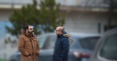 Two members of the Gülenist Terror Group’s (FETÖ) wanted by Türkiye, Celal Fındık (L) and Ercan Karakoyun (R), are seen chatting on a street in Berlin, Germany, Jan. 26, 2023. (Photo by Abdurrahman Şimşek)